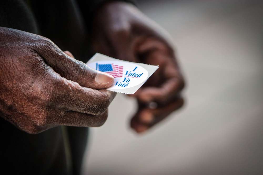 Person holding "I Voted Today" sticker